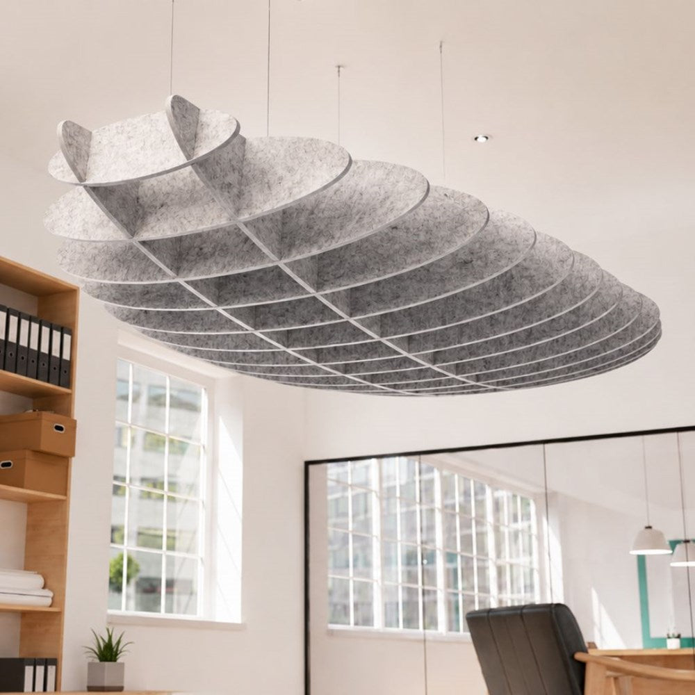 A large, organic-shaped ceiling light fixture made of layered gray felt or fabric, suspended from the ceiling in a bright modern office space.