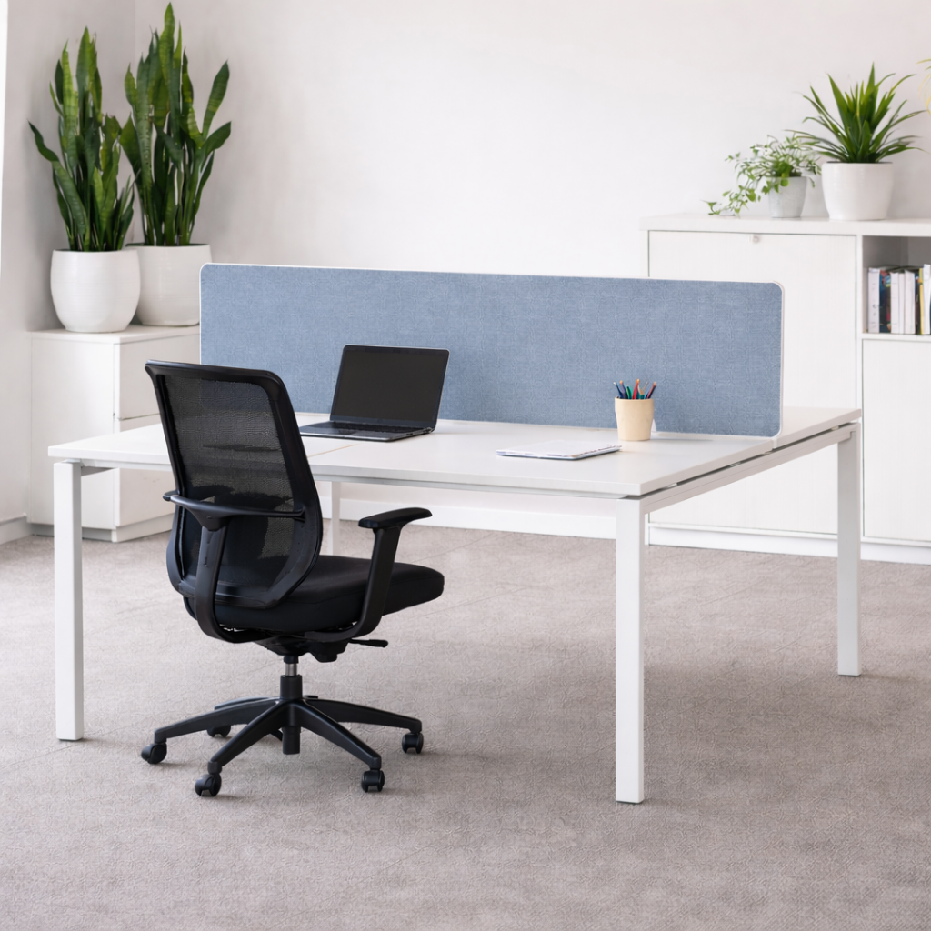 Modern office desk setup with a black chair, white desk, and blue screen divider.