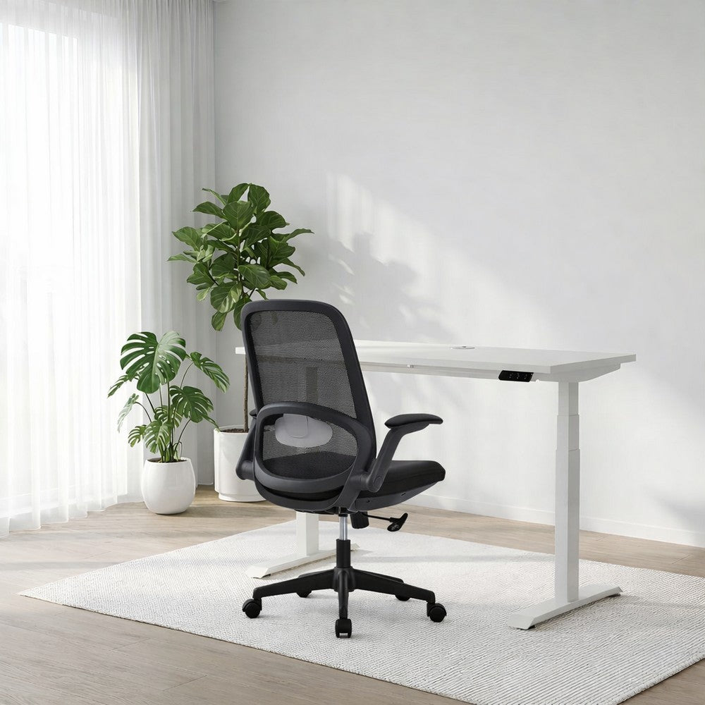 Modern office setup with a black ergonomic chair and white desk in a bright room.