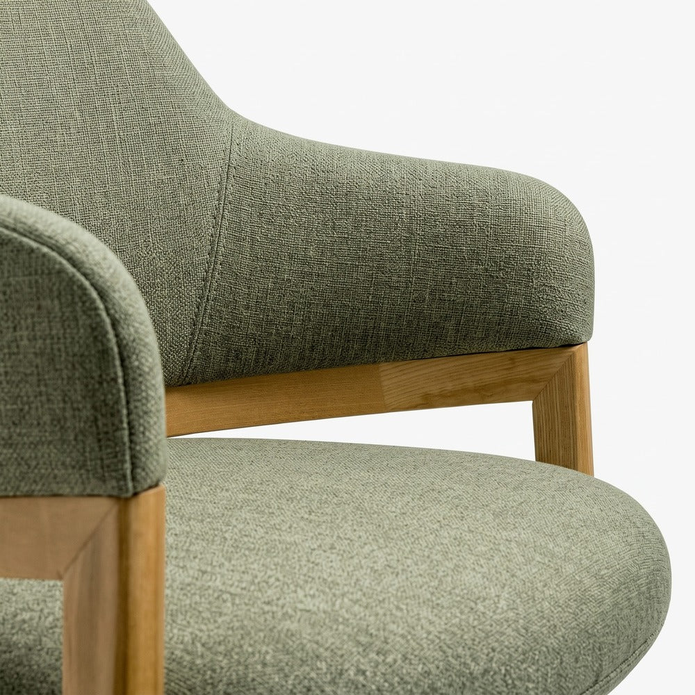 close up of sage green fabric visitor chair
