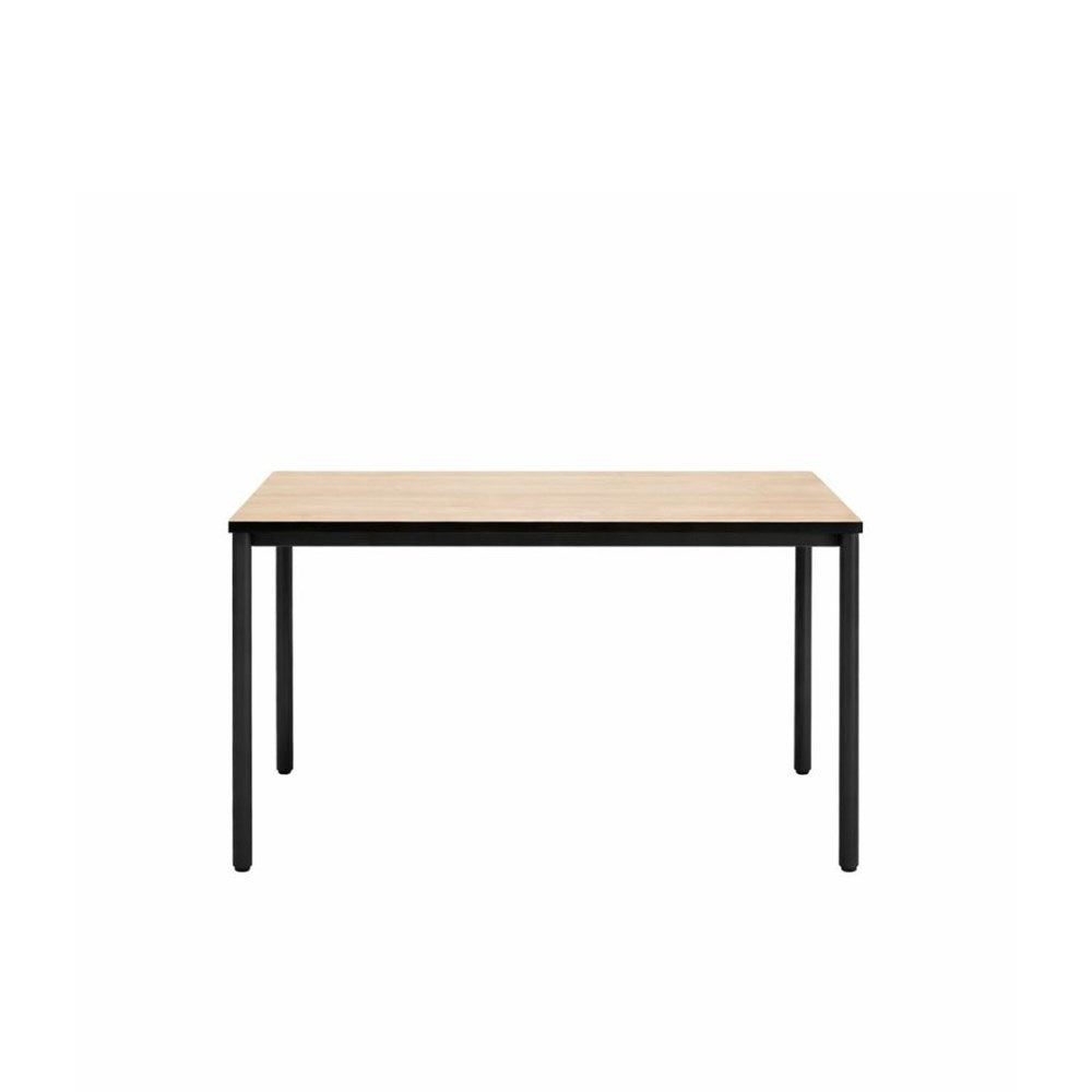 A minimalist rectangular table with a light natural wood grain top and slim black metal legs, shown against a solid white background.