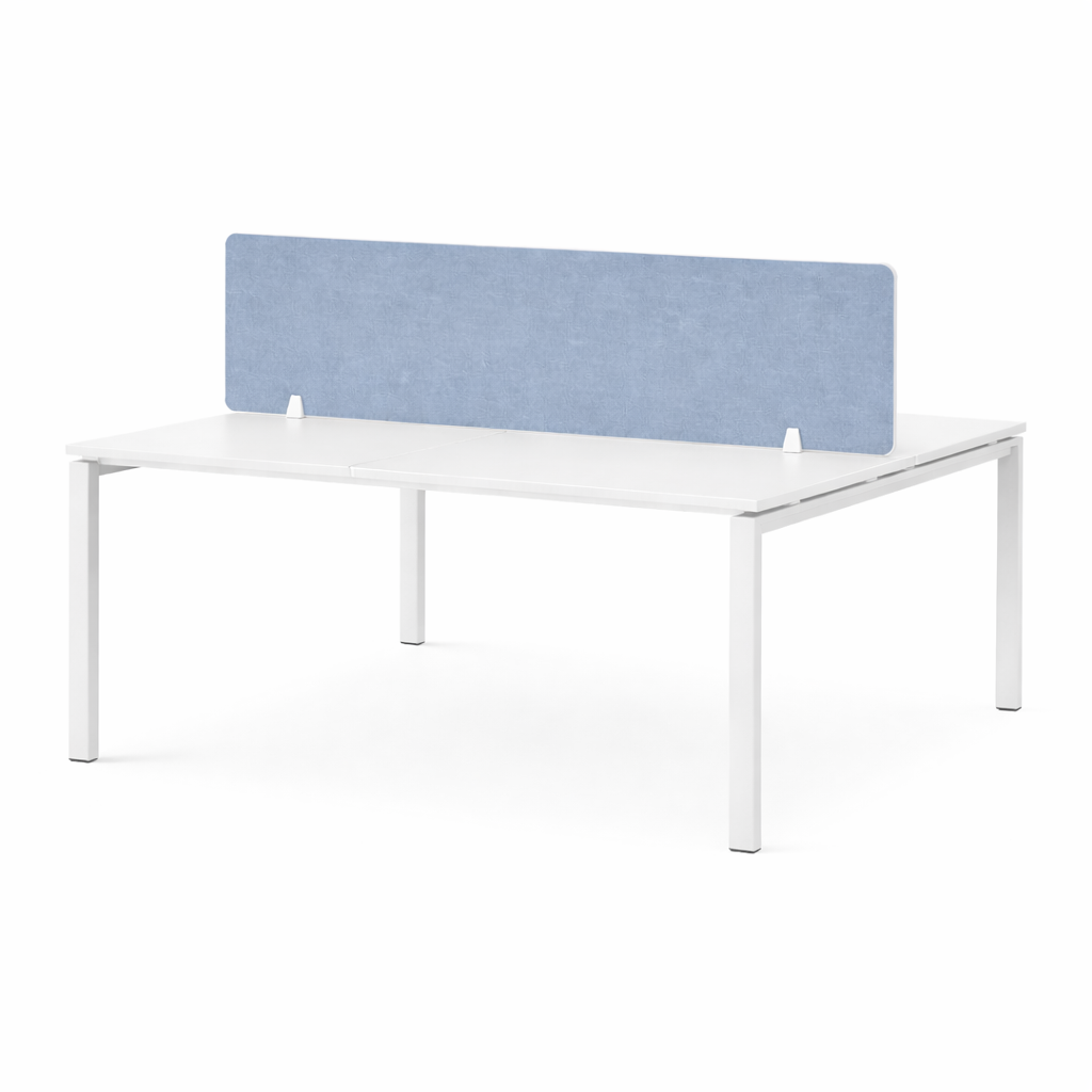 White shared office desk with a light blue screen