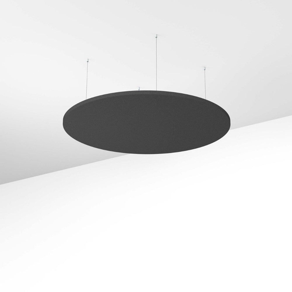 Black circular object on a white surface with a light gray background