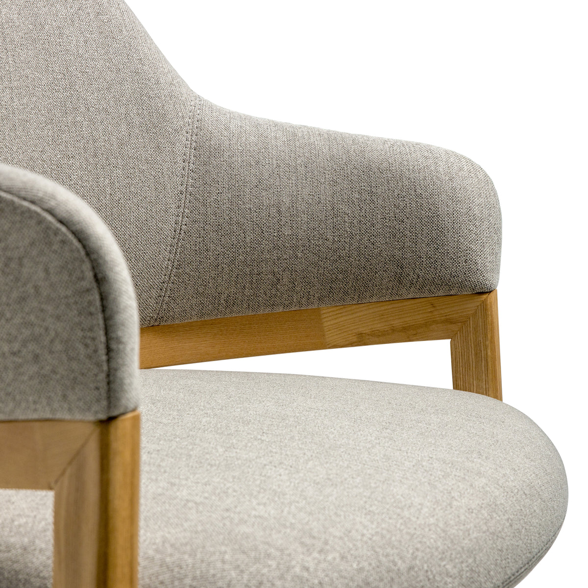 close up detail shot of oatmeal armchair with wooden legs